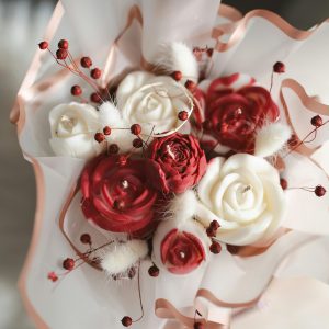 A beautiful floral arrangement featuring red and white roses, perfect for romantic events like Valentine's Day and Mother's Day.