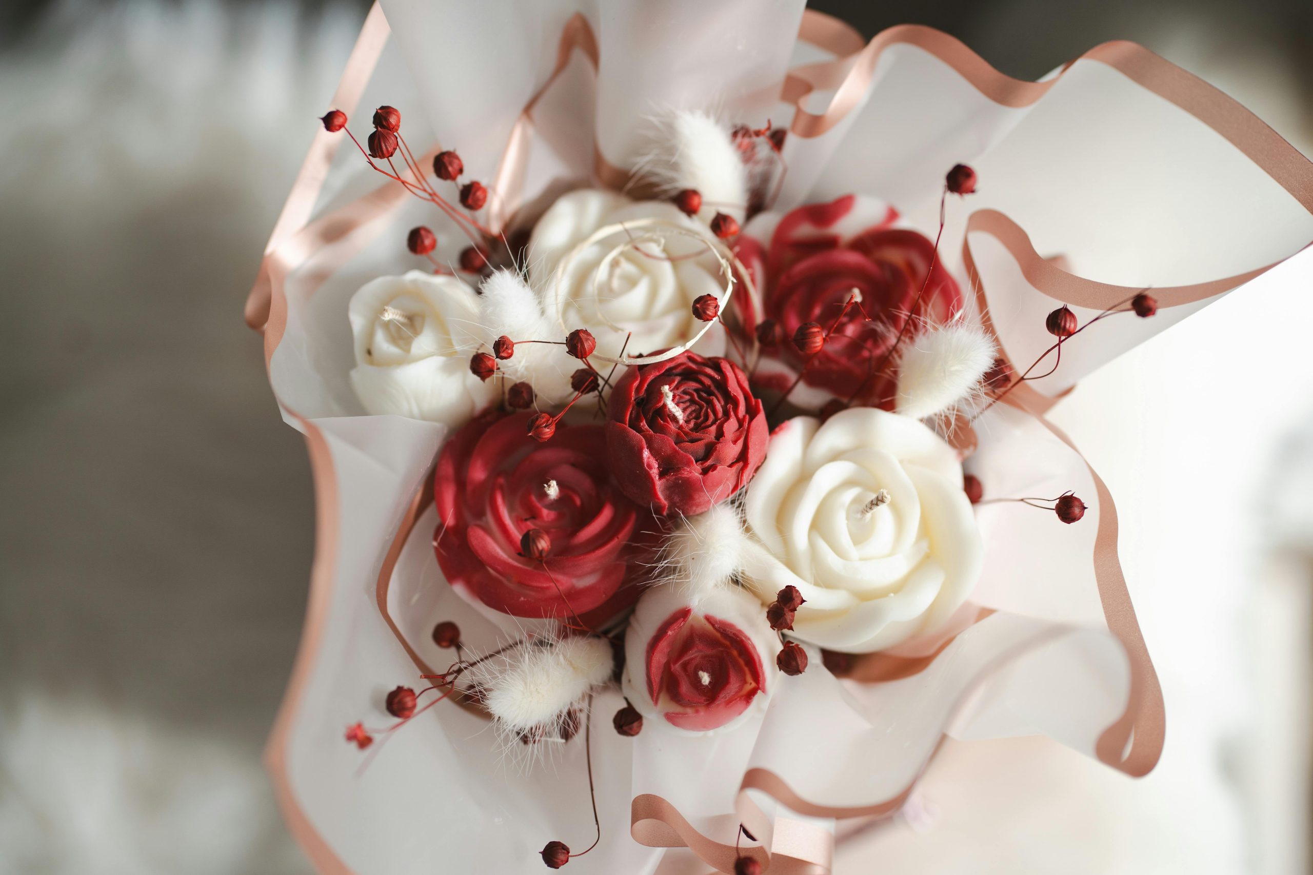 A beautiful floral arrangement featuring red and white roses, perfect for romantic events like Valentine's Day and Mother's Day.